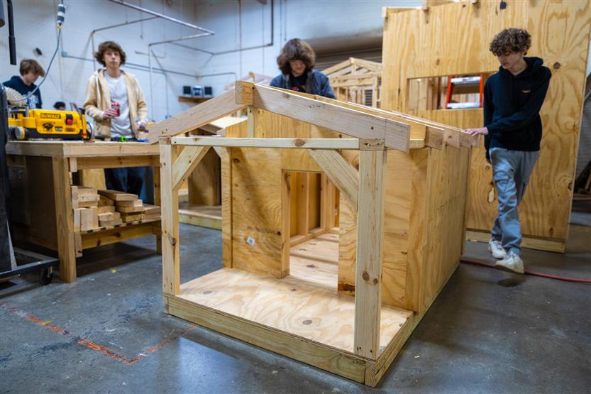 Students build doghouses